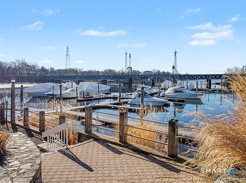 9 River Road, Unit 418 Greenwich, CT 06807 - Photo 37 of 38 a view of a terrace with seating area