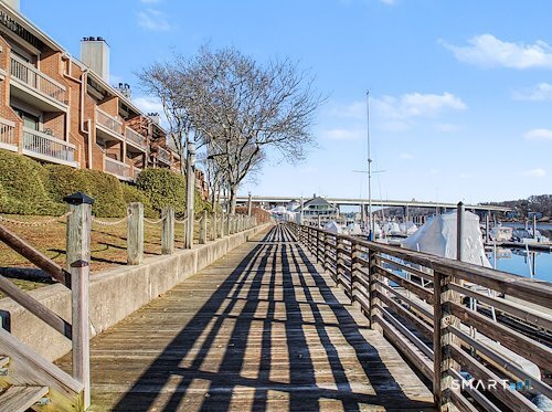 9 River Road, Unit 418 Greenwich, CT 06807 - Photo 38 of 38 a view of a balcony with wooden floor and city view