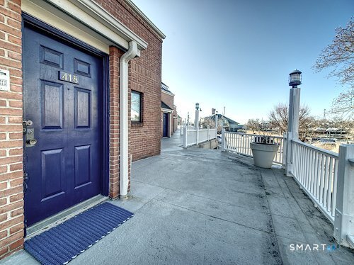 9 River Road, Unit 418 Greenwich, CT 06807 - Photo 4 of 38 a view of a balcony with an outdoor space