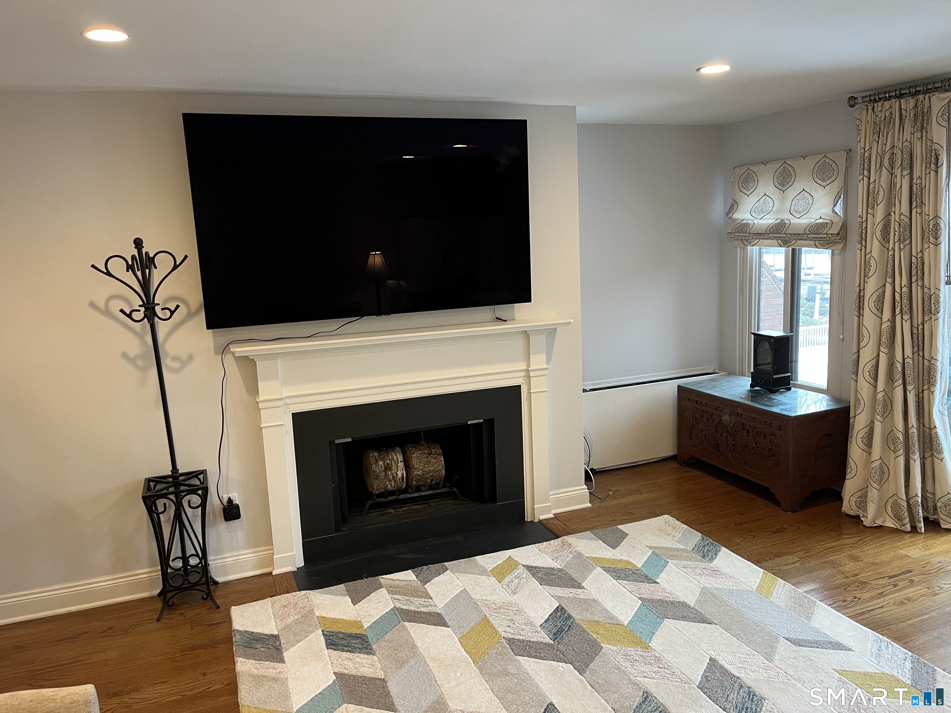 9 River Road, Unit 418 Greenwich, CT 06807 - Photo 7 of 38 a living room with furniture and a fireplace