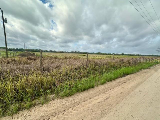 Southwest 80th Street Trenton, FL 32693 - Photo 10 of 11 a view of a lake with beach and big yard