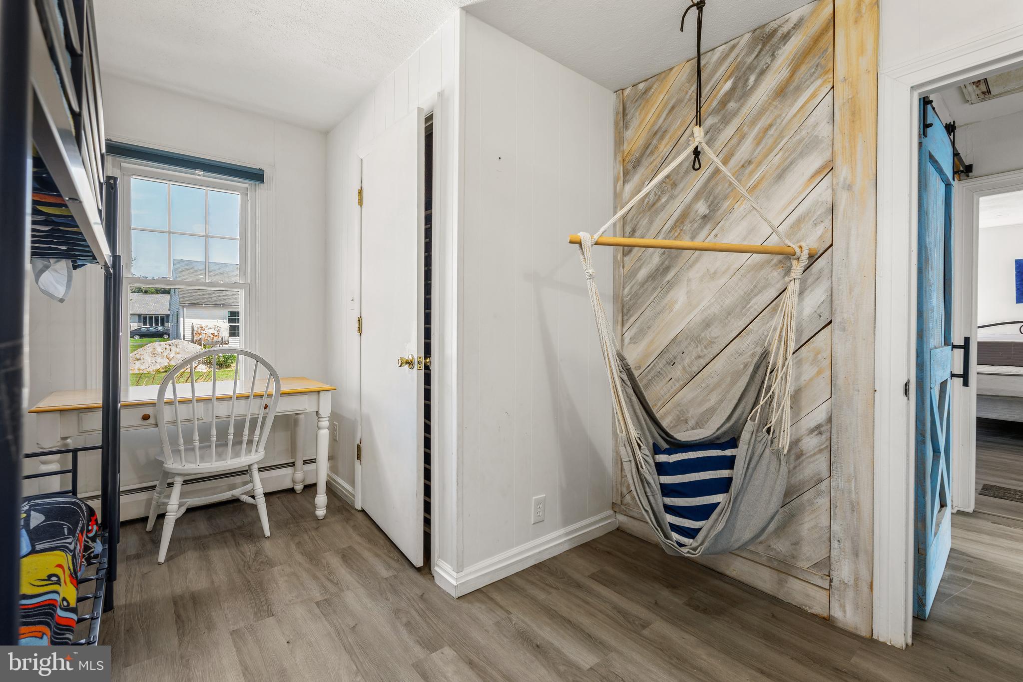 1123 Ball Park Road Fishing Creek, MD 21634 - Photo 26 of 39 a room with wooden floor and furniture