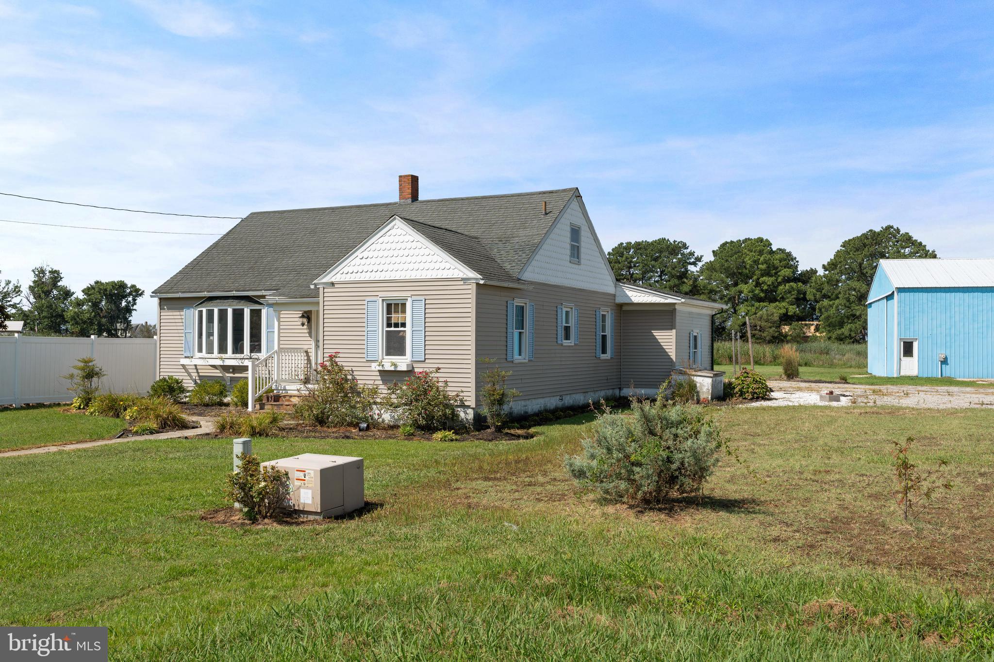1123 Ball Park Road Fishing Creek, MD 21634 - Photo 3 of 39 a front view of house with yard and green space