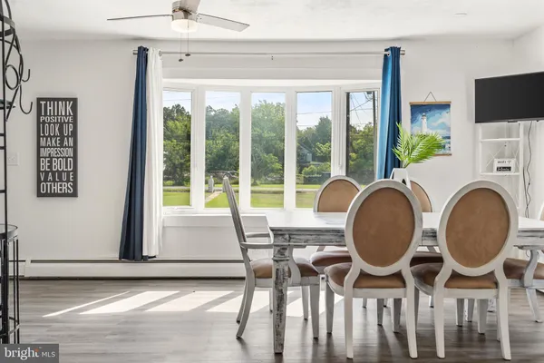 a dining room with furniture garden view and a fireplace