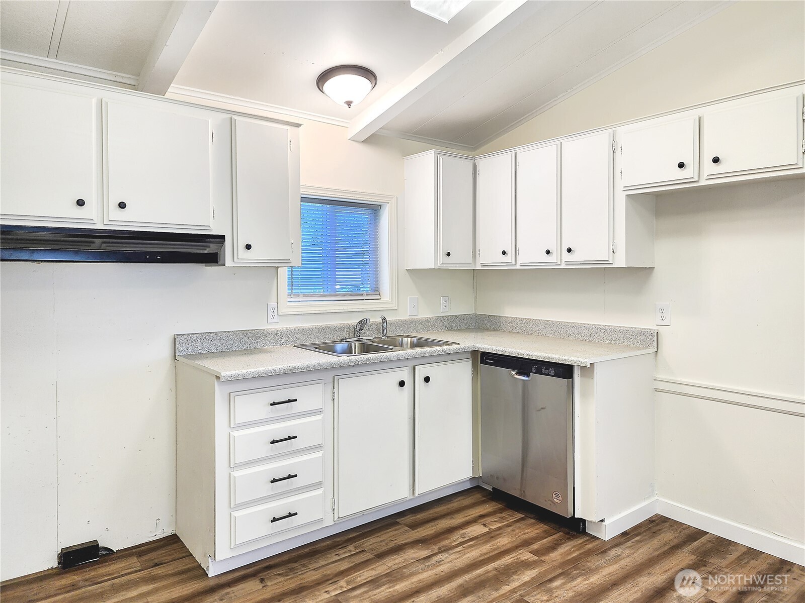 176 Nix Lane Centralia, WA 98531 - Photo 8 of 25 a kitchen with granite countertop white cabinets and sink