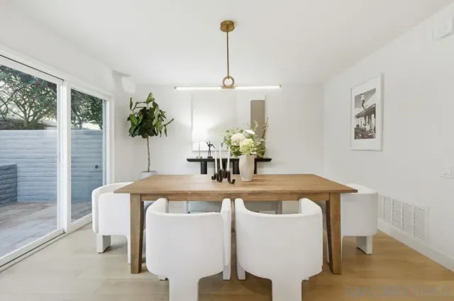 a dining room with furniture and window