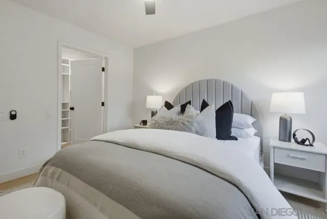 a bed room with a bed and a lamp