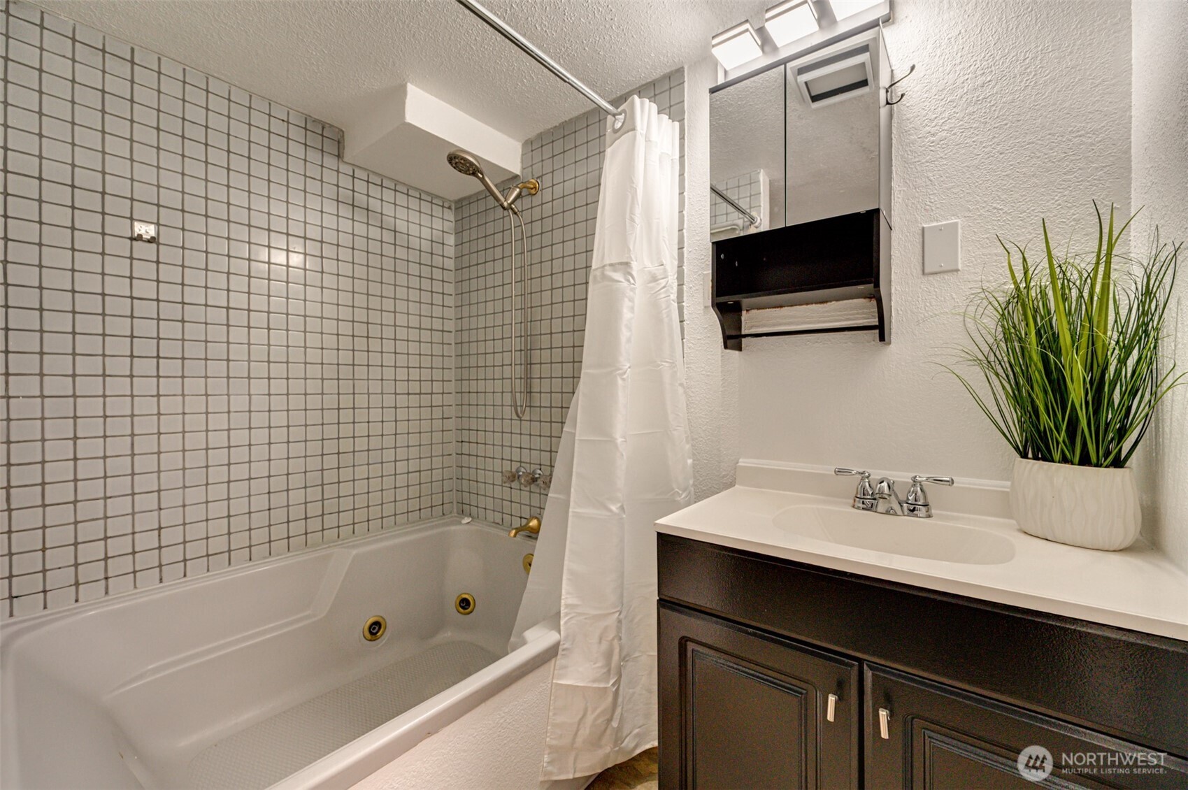 2126 Lewis River Road Woodland, WA 98674 - Photo 8 of 23 a bathroom with a sink a bathtub and a mirror