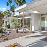 a view of a patio with table and chairs and potted plants