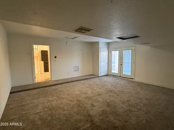 a view of an empty room with a window