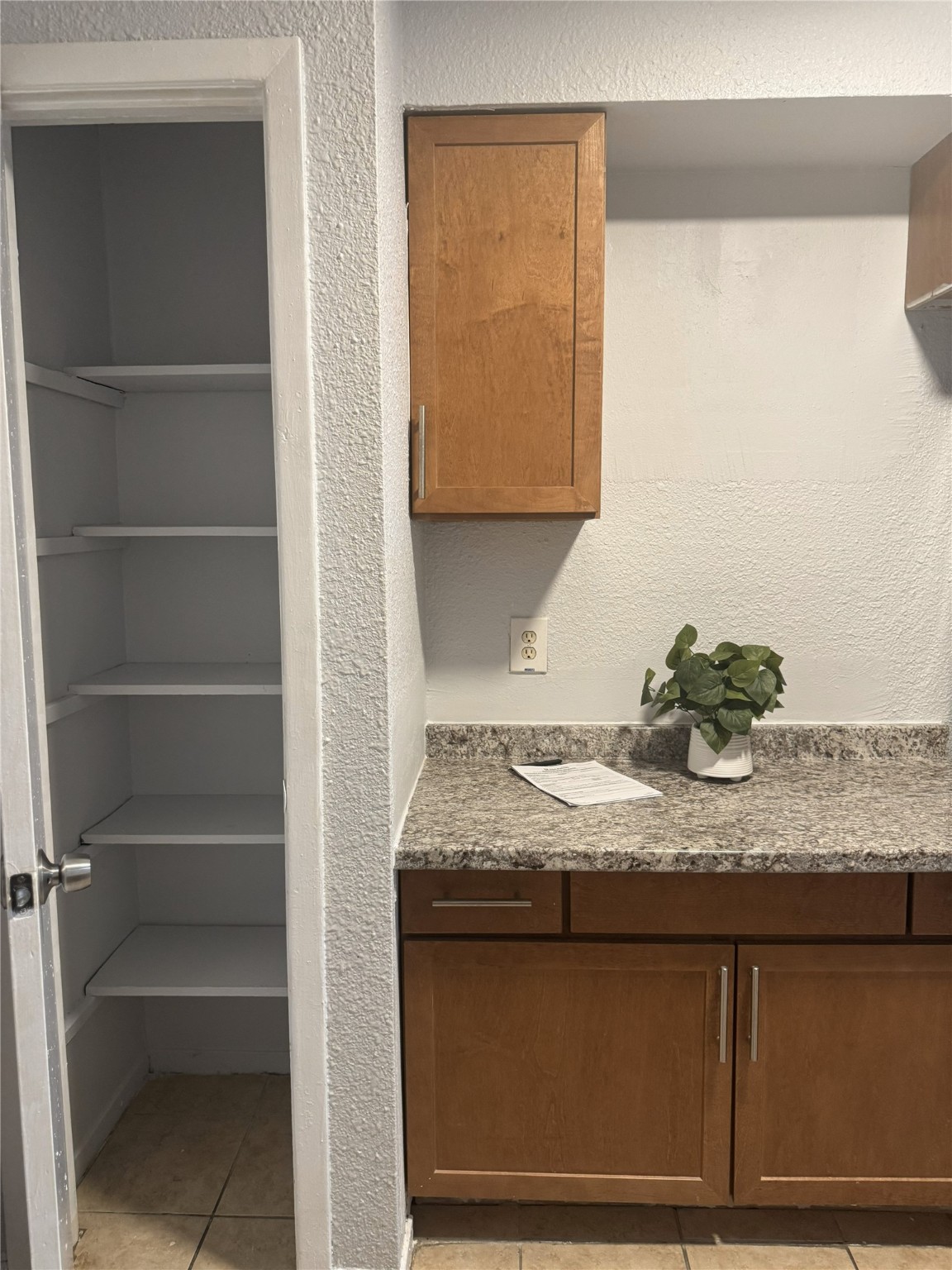 9100 Dodson Street, Unit 10 Houston, TX 77093 - Photo 3 of 11 a bathroom with a granite countertop sink and a mirror