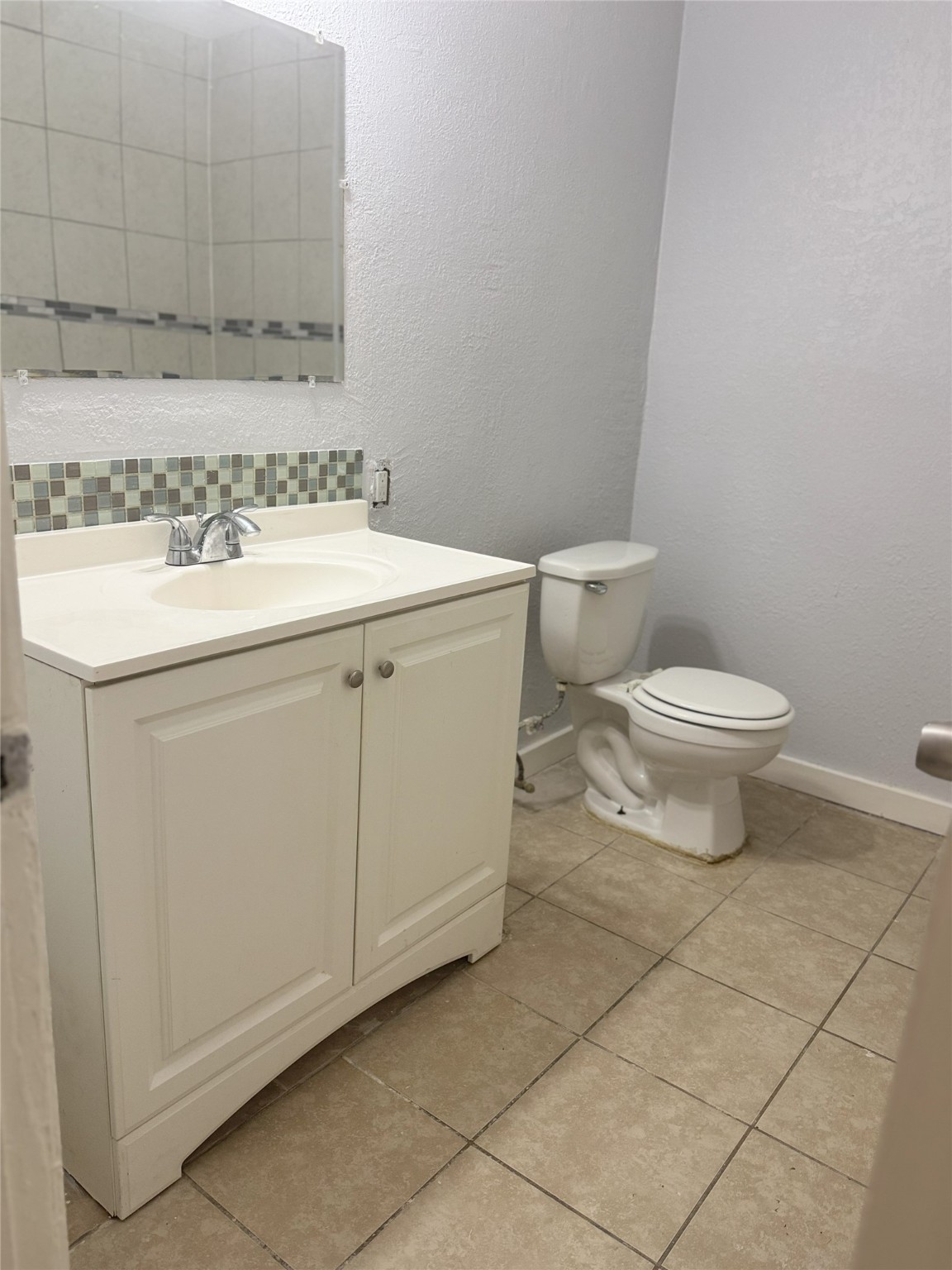 9100 Dodson Street, Unit 10 Houston, TX 77093 - Photo 9 of 11 a bathroom with a sink toilet and vanity