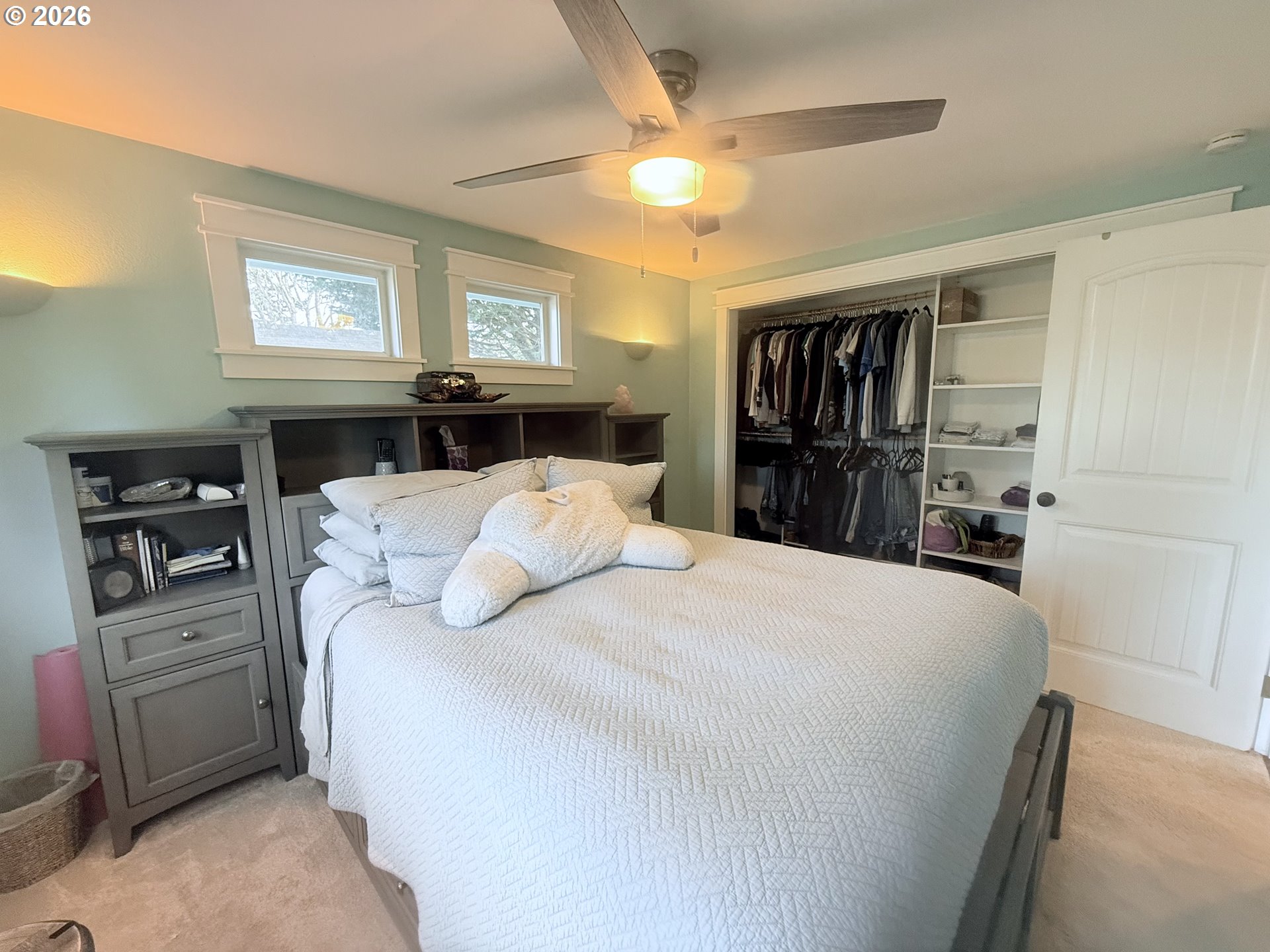 370 North Wall Street Coos Bay, OR 97420 - Photo 19 of 36 a bedroom with a large bed and a tv