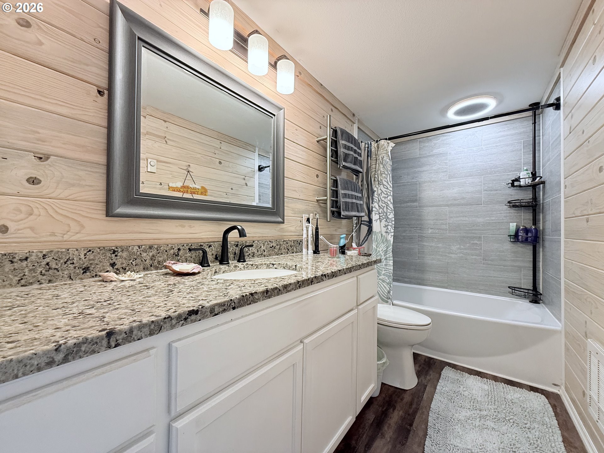 370 North Wall Street Coos Bay, OR 97420 - Photo 21 of 36 a bathroom with a granite countertop sink toilet and shower