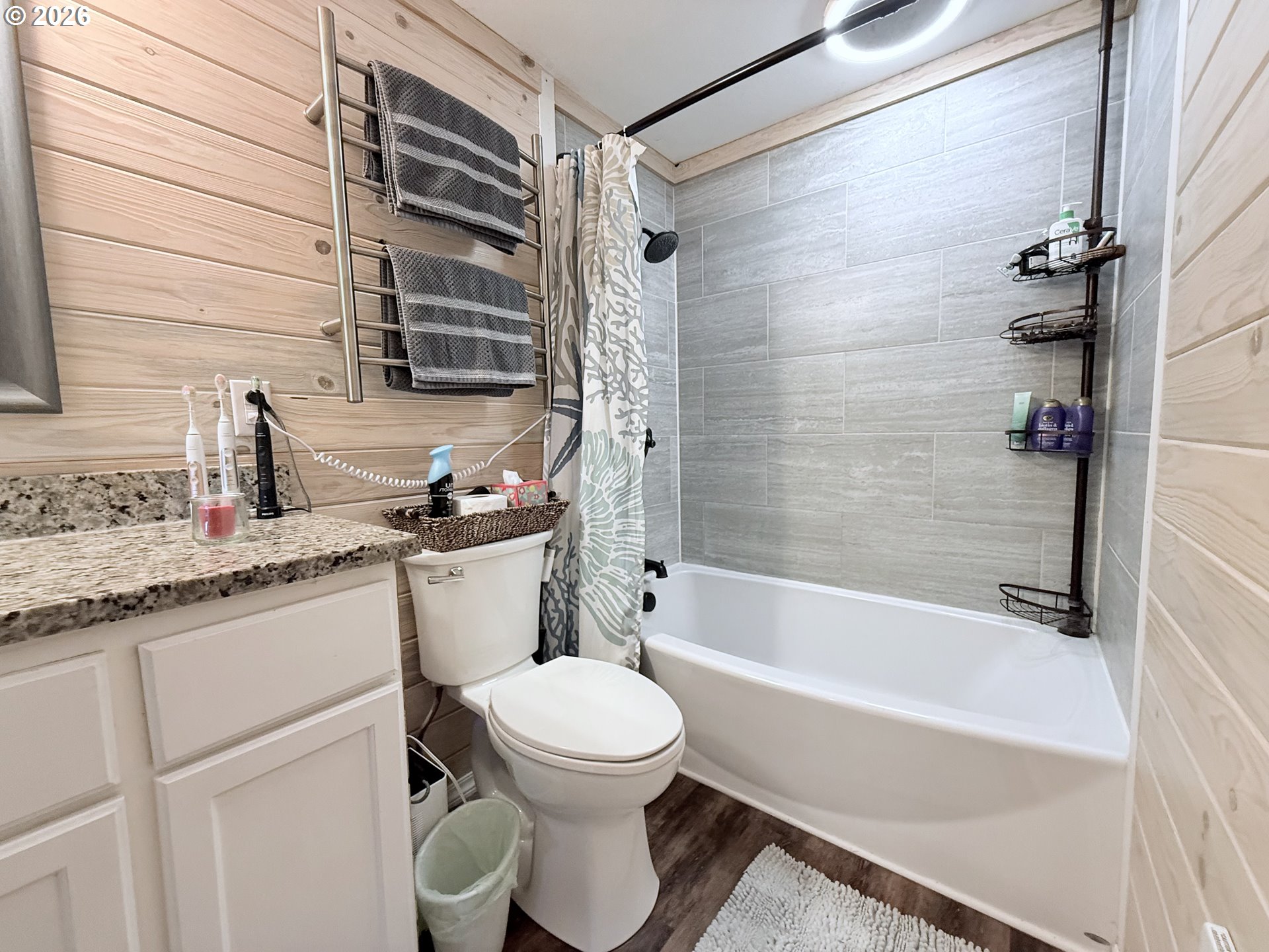 370 North Wall Street Coos Bay, OR 97420 - Photo 22 of 36 a bathroom with a granite countertop sink toilet and shower