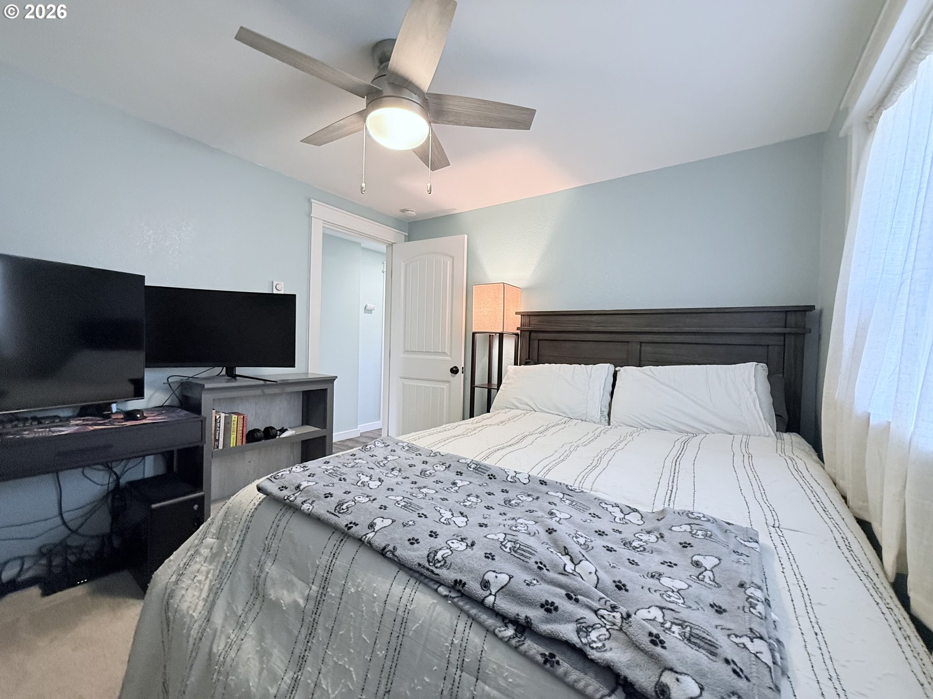 370 North Wall Street Coos Bay, OR 97420 - Photo 24 of 36 a bedroom with a bed and a flat screen tv