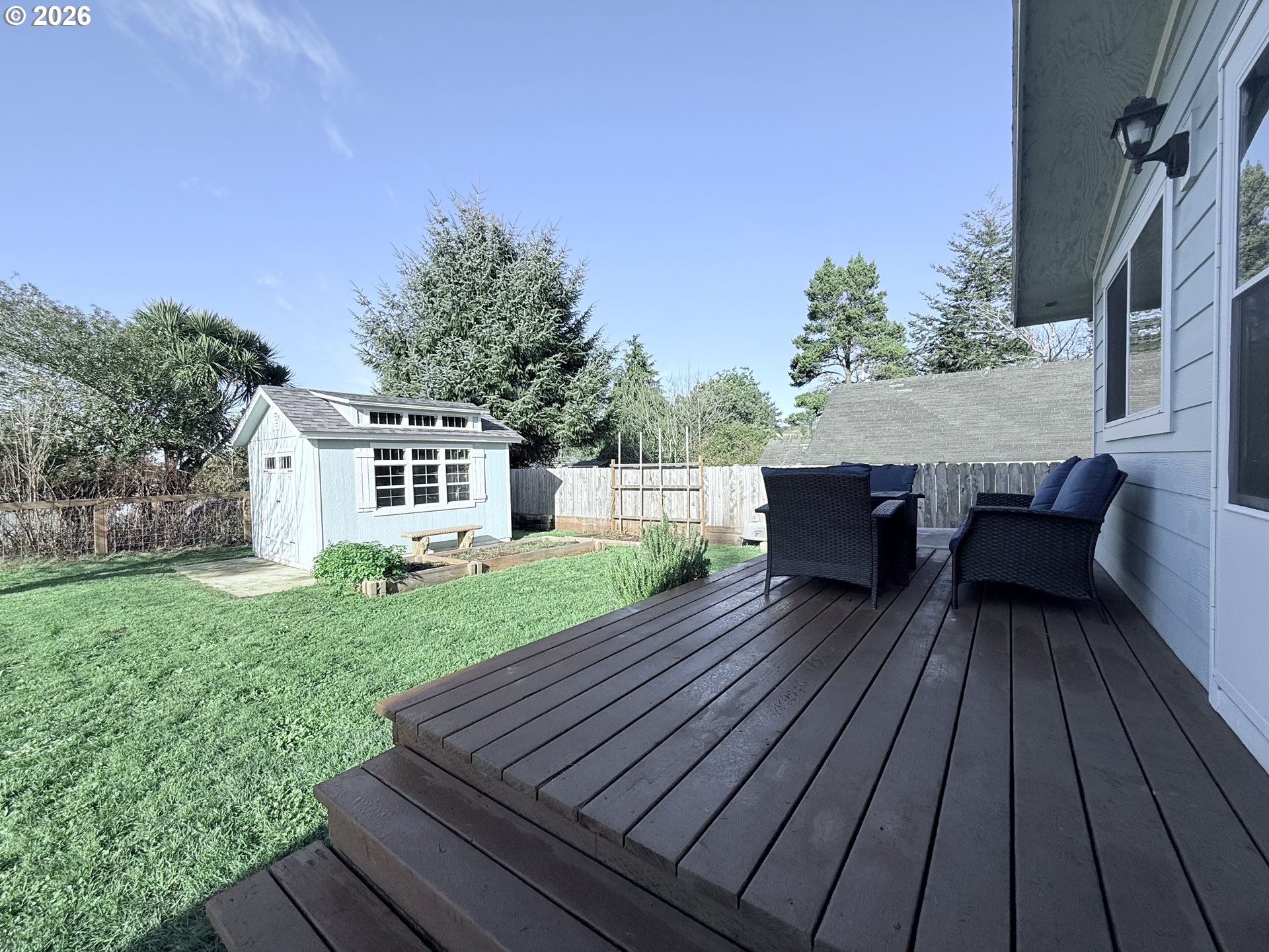 370 North Wall Street Coos Bay, OR 97420 - Photo 28 of 36 a view of deck with table and chairs a barbeque with wooden floor and fence