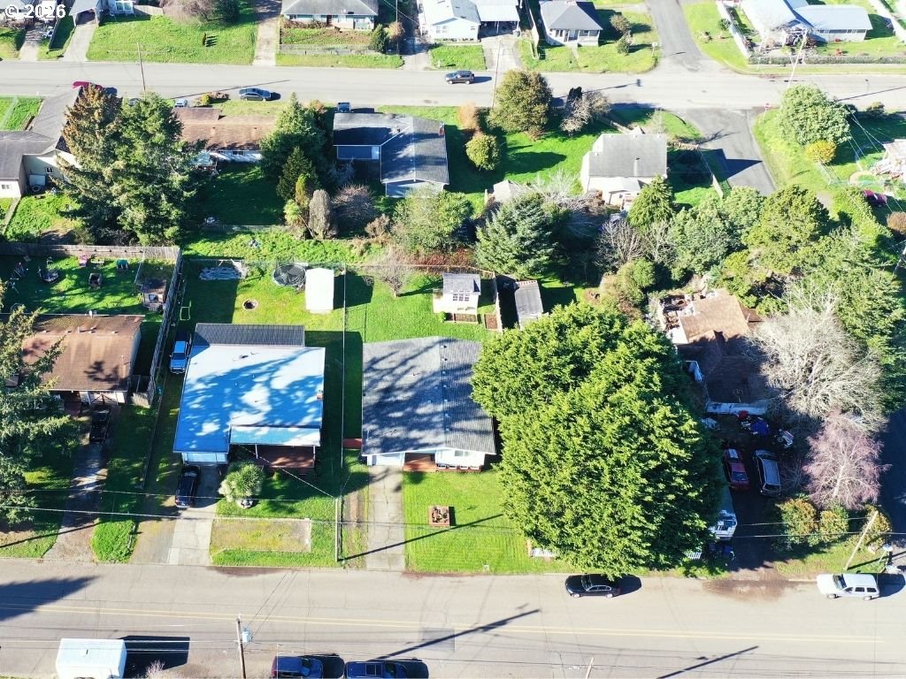 370 North Wall Street Coos Bay, OR 97420 - Photo 35 of 36 an aerial view of a house with a garden and lots of trees