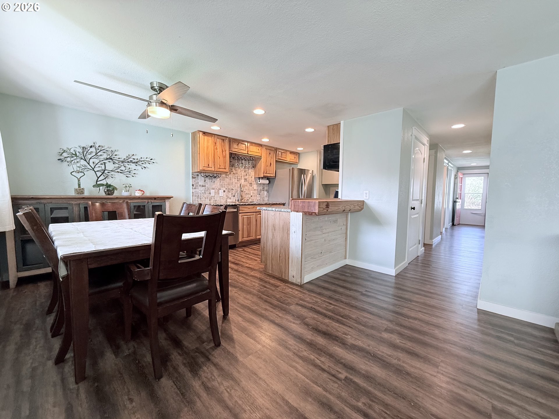 370 North Wall Street Coos Bay, OR 97420 - Photo 9 of 36 a view of a dining room with furniture and wooden floor