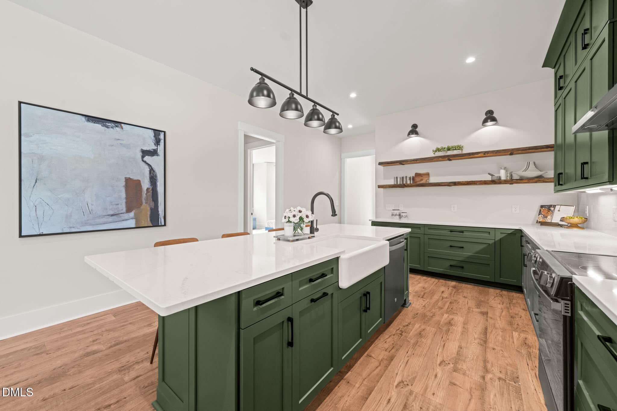 400 Pilot Ridge Road Zebulon, NC 27597 - Photo 15 of 51 a spacious kitchen with stainless steel appliances granite countertop a sink a stove and a wooden floors
