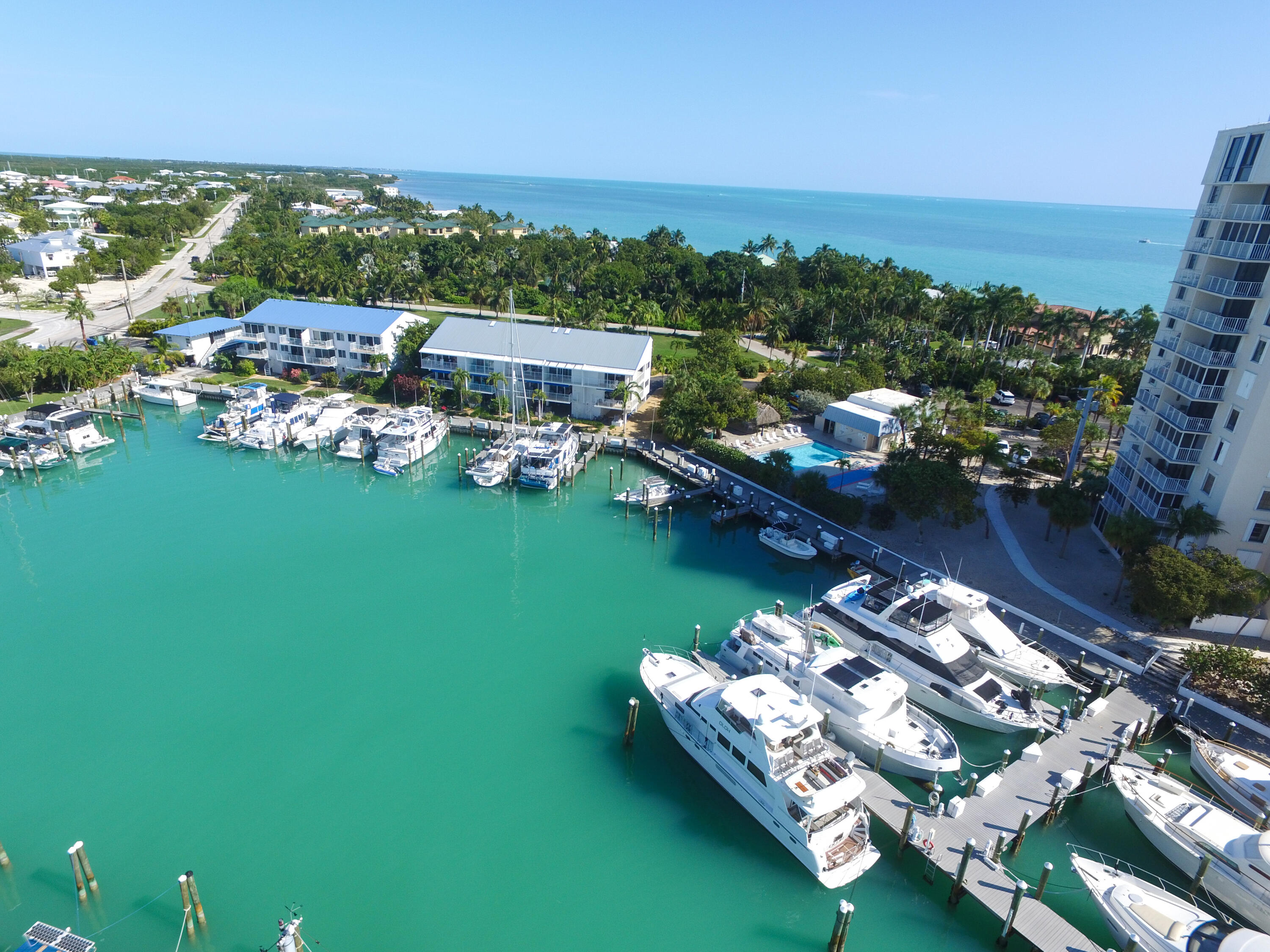 97 Coco Plum Drive, Unit T7 Marathon, FL 33050 - Photo 12 of 24 a view of a lake with lawn chairs