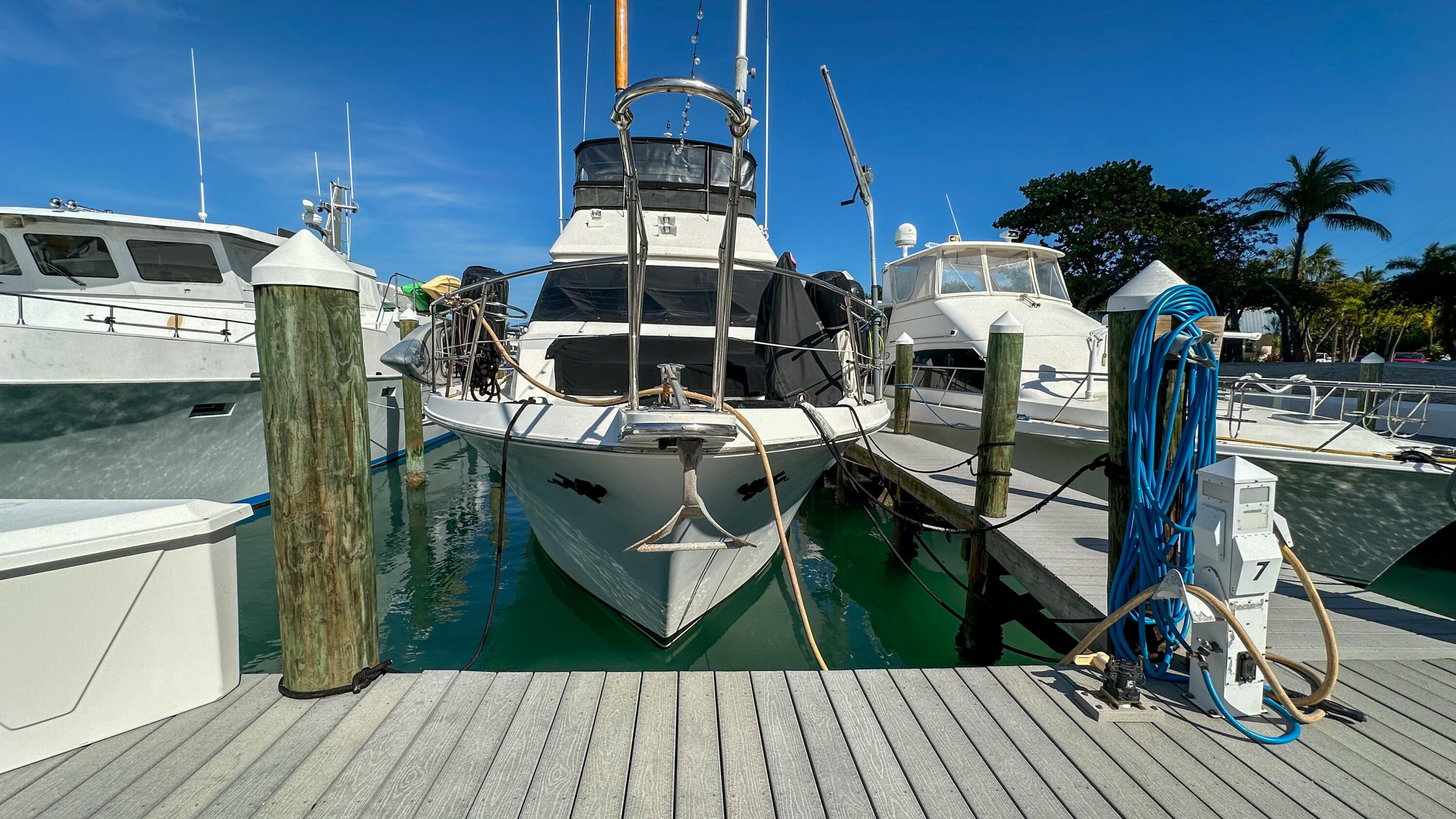 97 Coco Plum Drive, Unit T7 Marathon, FL 33050 - Photo 2 of 24 a view of a chairs and table on the wooden floor