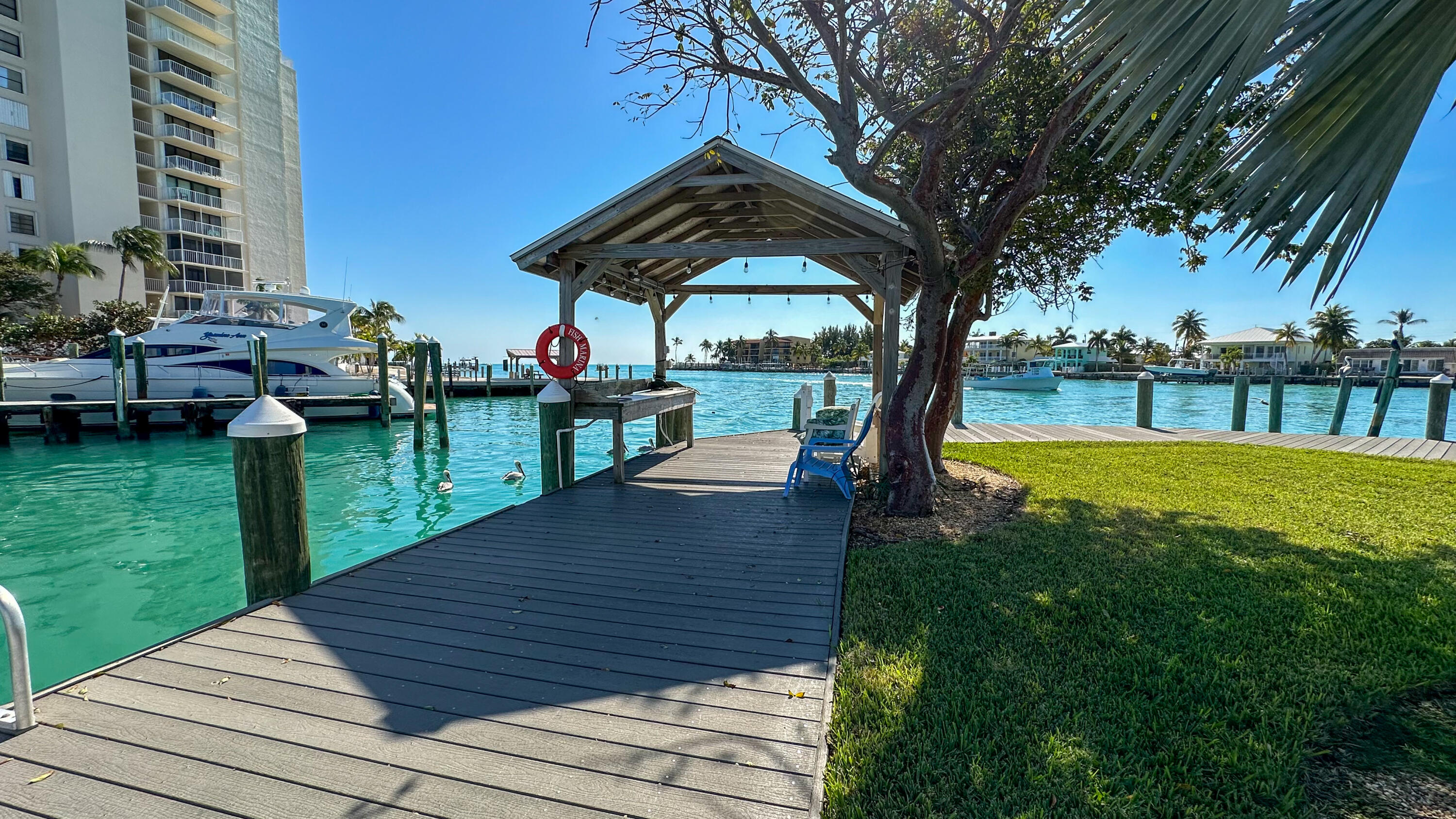 97 Coco Plum Drive, Unit T7 Marathon, FL 33050 - Photo 21 of 24 a view of a backyard with sitting area