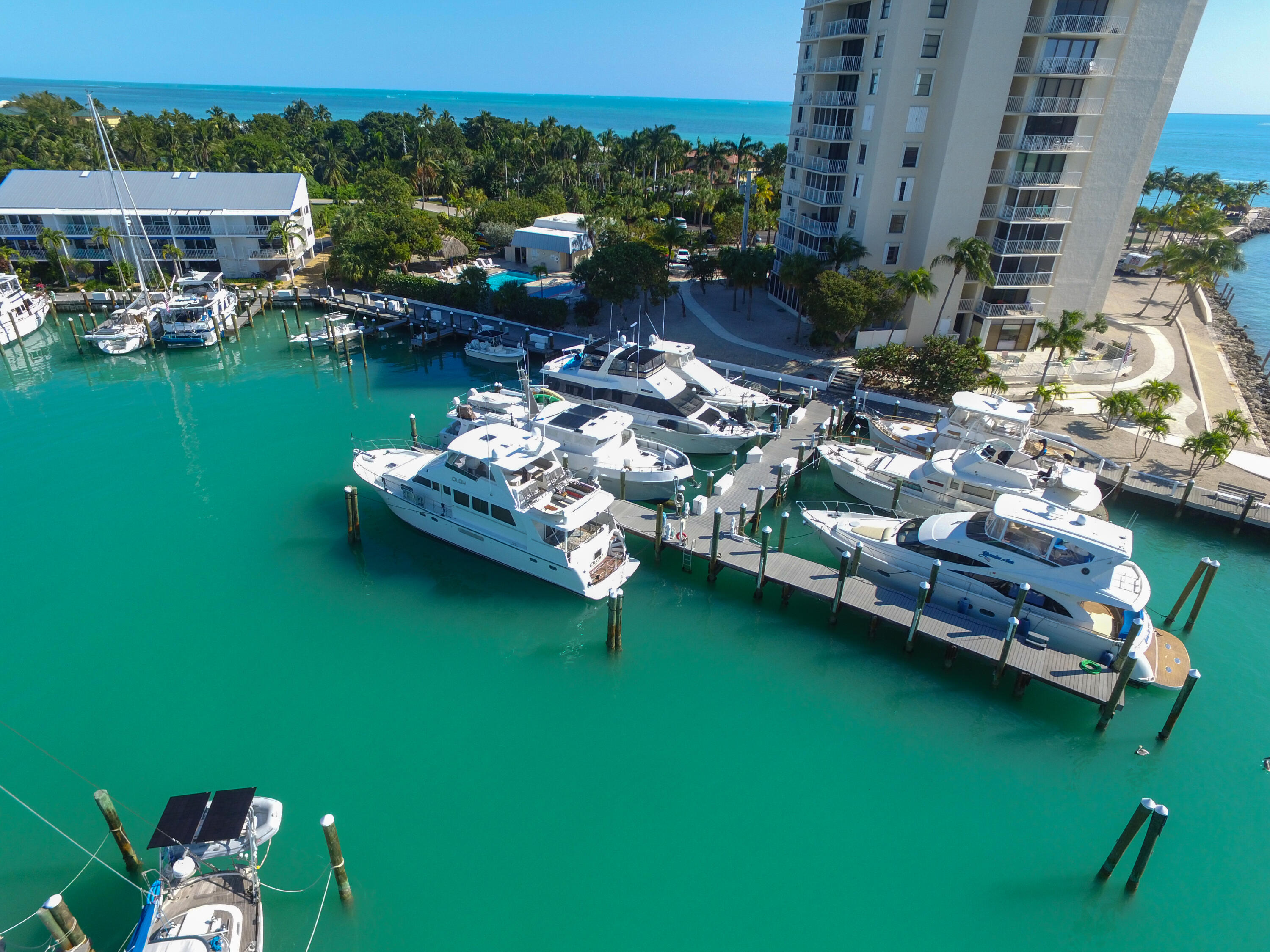 97 Coco Plum Drive, Unit T7 Marathon, FL 33050 - Photo 23 of 24 a view of a lake with lawn chairs and a table