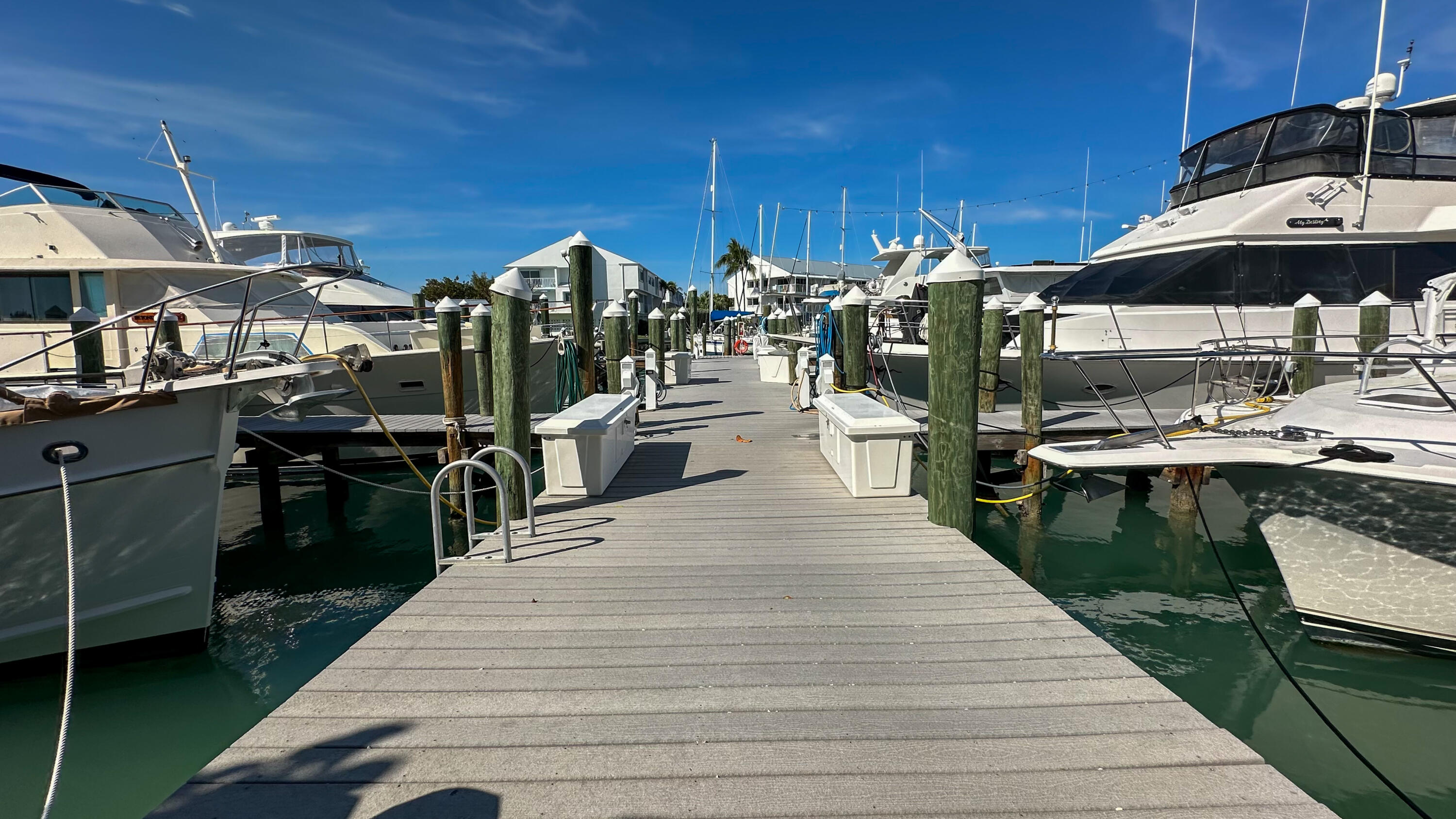 97 Coco Plum Drive, Unit T7 Marathon, FL 33050 - Photo 5 of 24 a view of a patio with chairs and plants