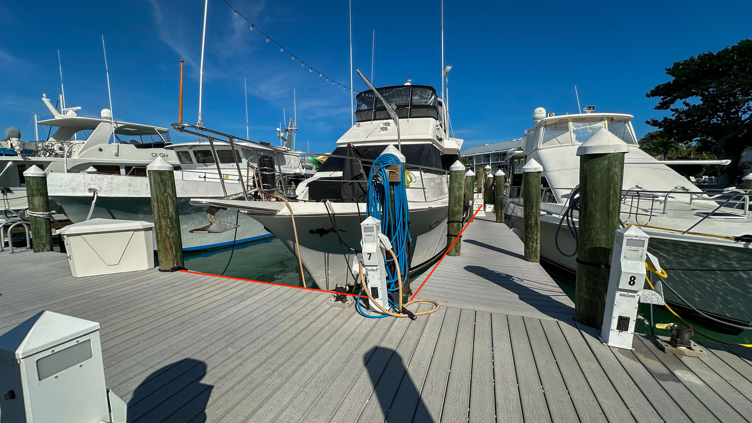97 Coco Plum Drive, Unit T7 Marathon, FL 33050 - Photo 7 of 24 a kitchen with stainless steel appliances wooden floors stove and cabinets