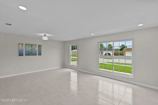 a front view of house with yard and trees