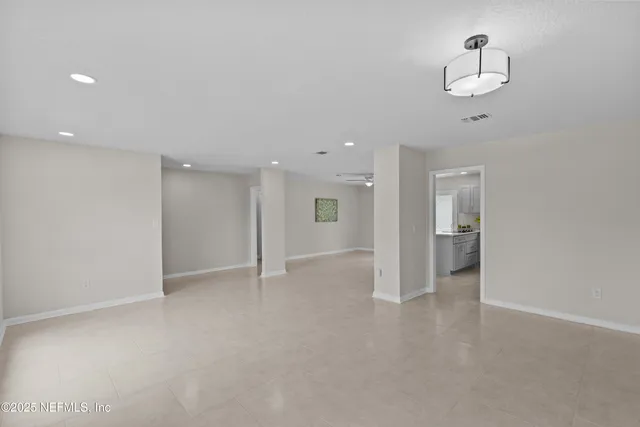 an aerial view of a house with a big yard