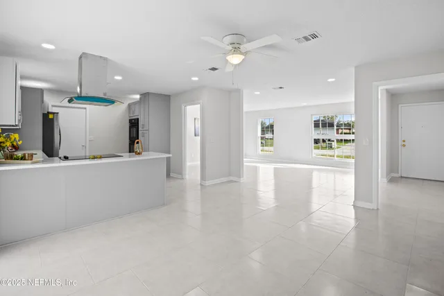 an aerial view of a house with a swimming pool yard and outdoor seating