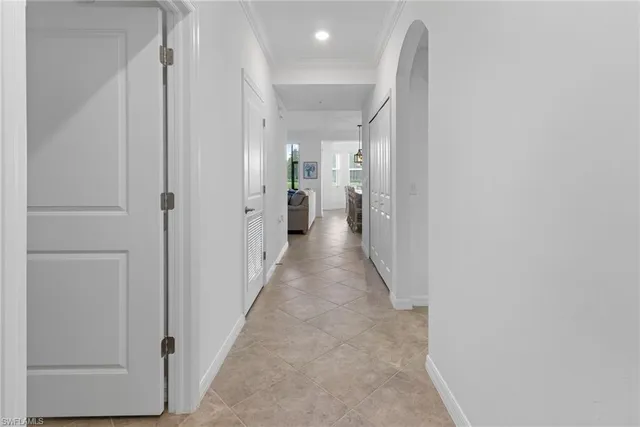a view of a hallway with wooden shelves