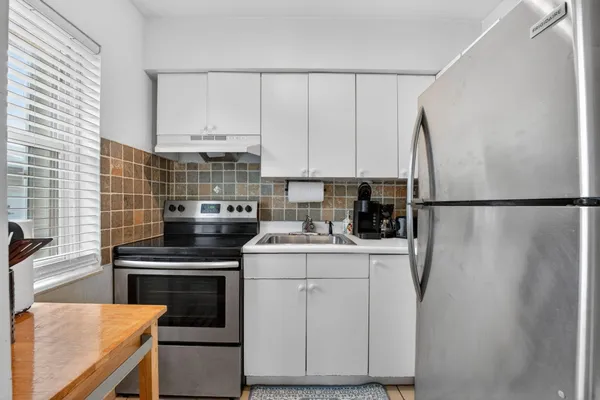 a bedroom with a bed and a window in it