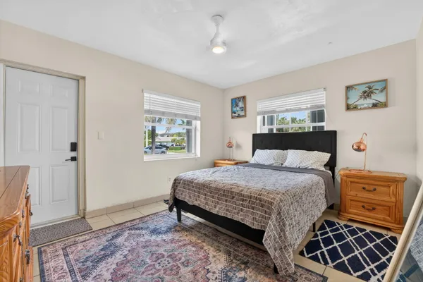 a bedroom with a bed and window