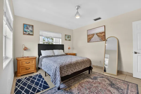 a bathroom with a granite countertop toilet sink and shower