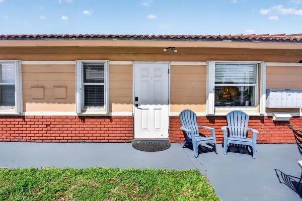 a living room with furniture wooden floor and a window
