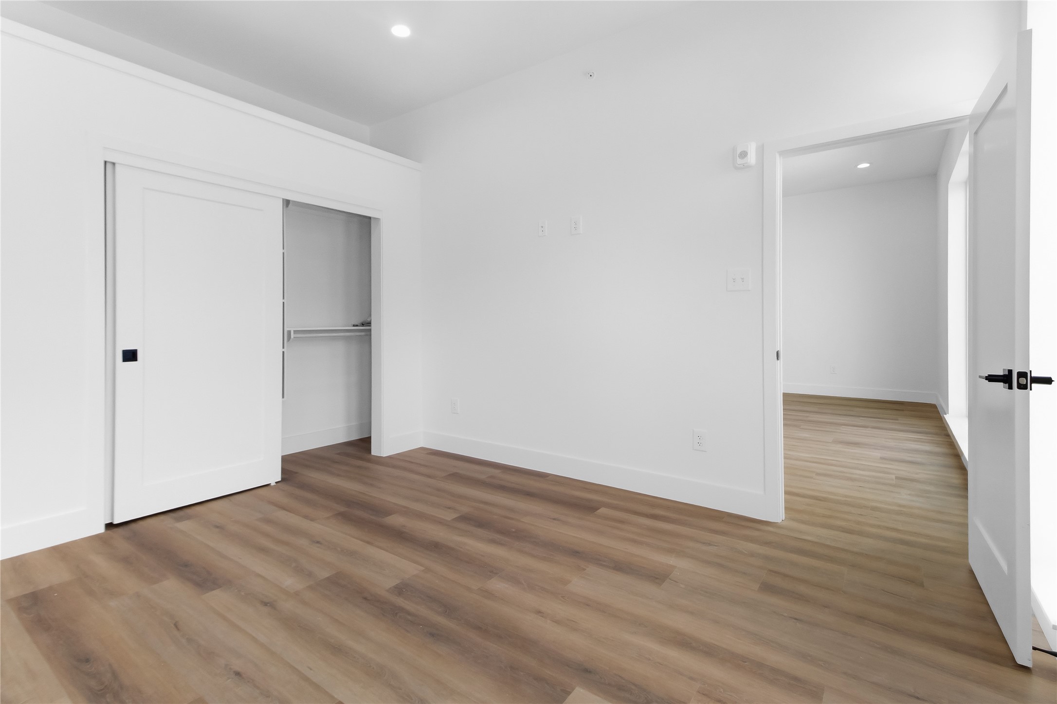 5614 Larkin Street, Unit G Houston, TX 77007 - Photo 17 of 20 a view of an empty room with wooden floor and closet