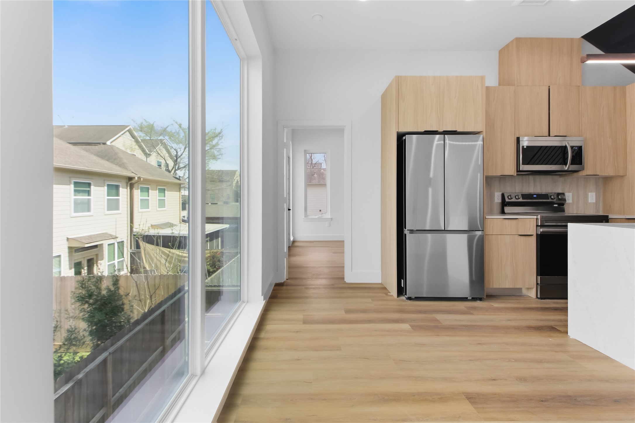 5614 Larkin Street, Unit G Houston, TX 77007 - Photo 9 of 20 a view of a kitchen with wooden floor and a kitchen