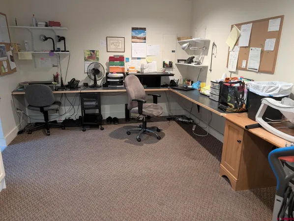 a room with furniture a flat screen tv and a window