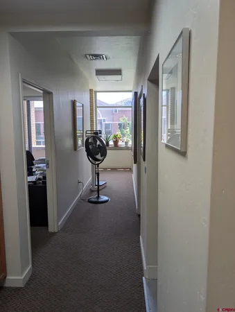 a view of a workspace with furniture