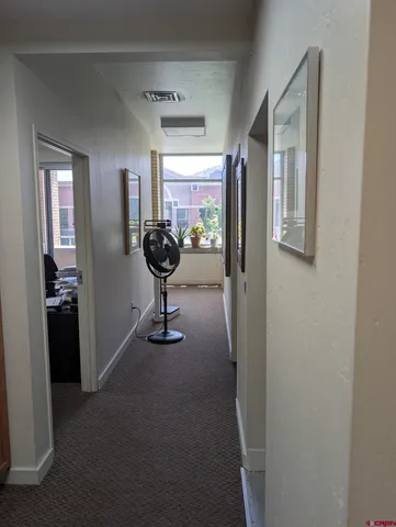 a view of a workspace with furniture
