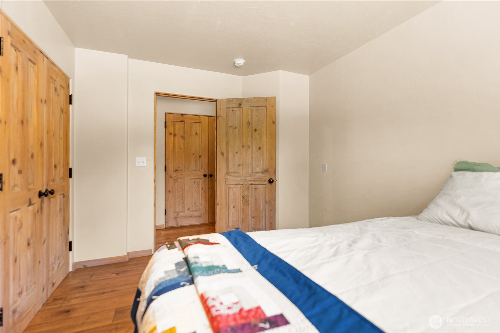 2621 Highway 153 Twisp, WA 98856 - Photo 17 of 40 a bedroom with a bed and a mirror