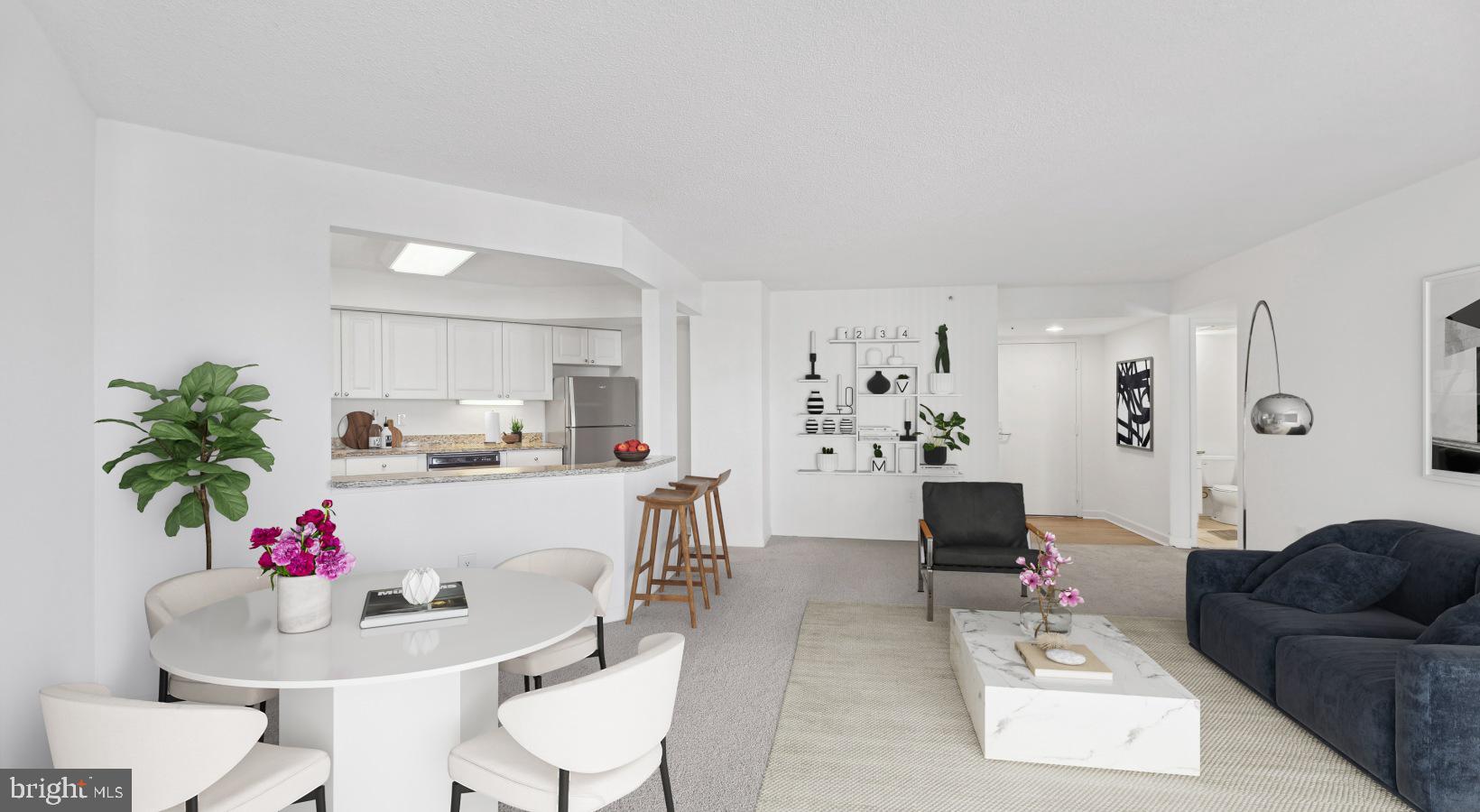 a living room with furniture and flowers