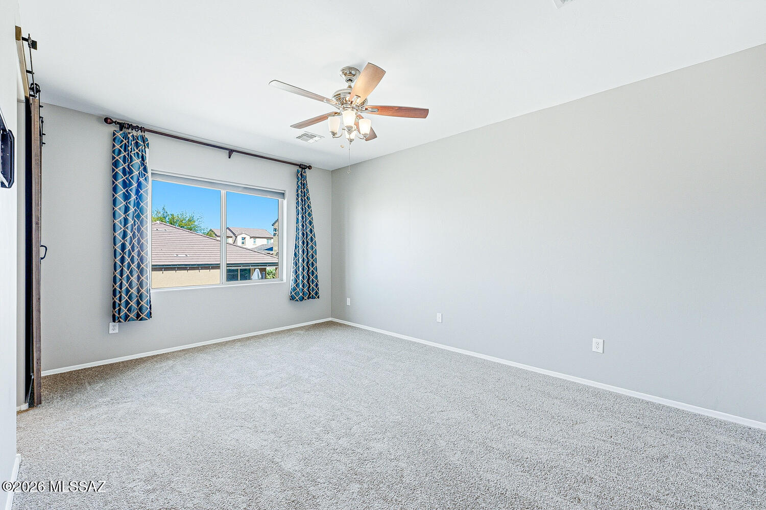 323 East Refuge Loop Vail, AZ 85641 - Photo 22 of 51 an empty room with windows and fan