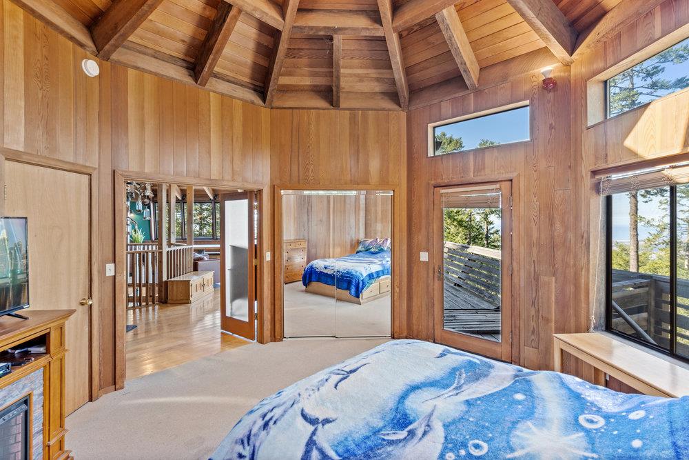 200 South Ranch Road Pescadero, CA 94060 - Photo 23 of 72 a bedroom with a bed and glass door