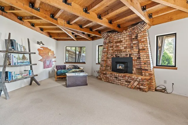 a view of balcony with wooden floor and outdoor seating