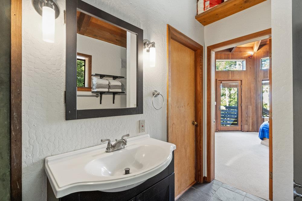200 South Ranch Road Pescadero, CA 94060 - Photo 31 of 72 a bathroom with a sink and a mirror