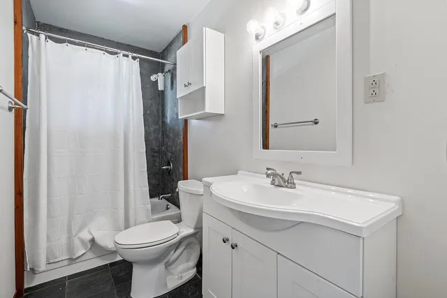 a view of a backyard with sitting area